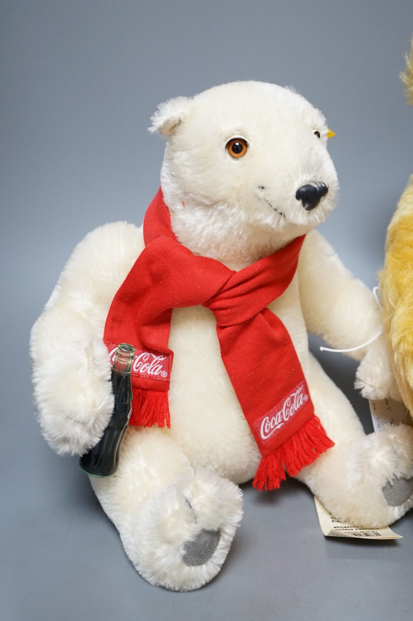 A Classic Bear Steiff, box, 43cm, with a yellow tag, a Coco Cola Bear Danbury Mint, 28cm with Winnie The Pohh Steiff, box, 18cm